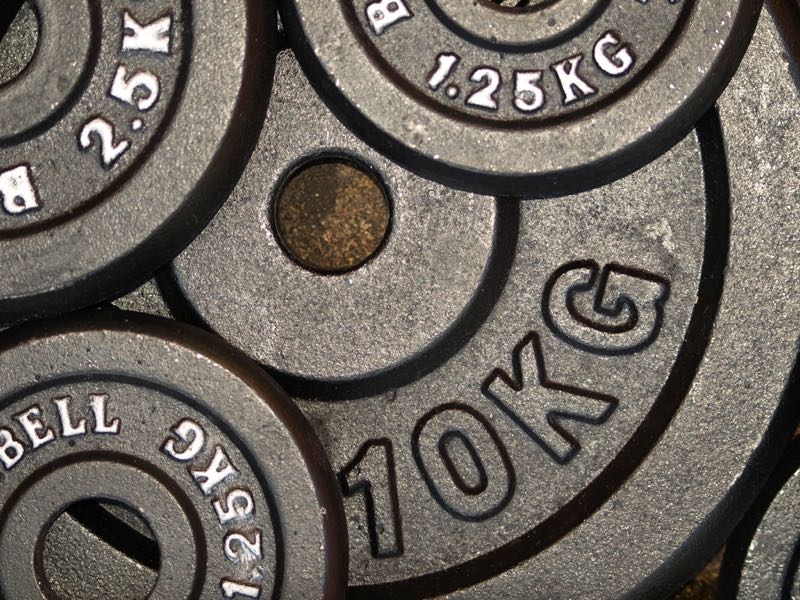 Close-up of stacked iron weight plates